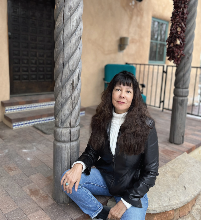 Santa Fe's author Deborah Taffa looks at the camera